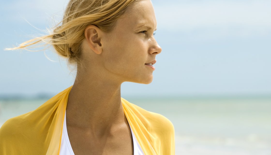 Woman squinting from the sun